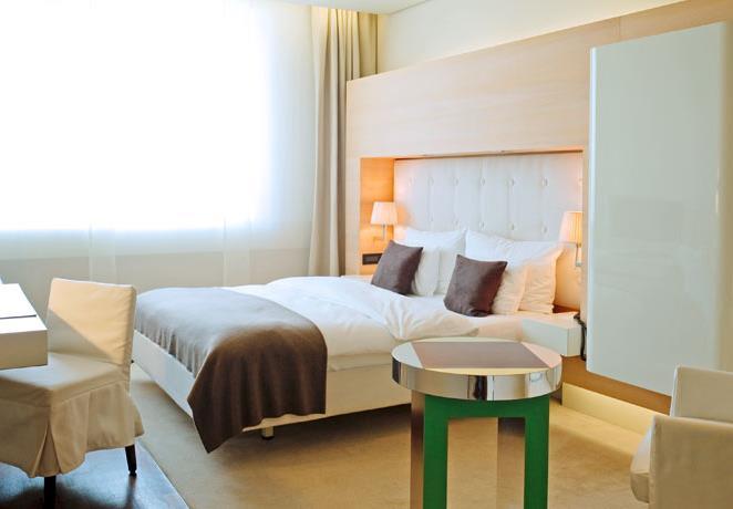 The air-conditioned rooms and suites at the 5-star Hotel SIDE are decorated with classic, modern-style wooden furniture.