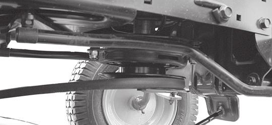 SERVICE AND ADJUSTMENTS ATTACH MOWER SIDE SUSPENSION ARMS (A) TO CHASSIS - Position hole in arm over pin (B) on outside of tractor chassis and secure with retainer spring.